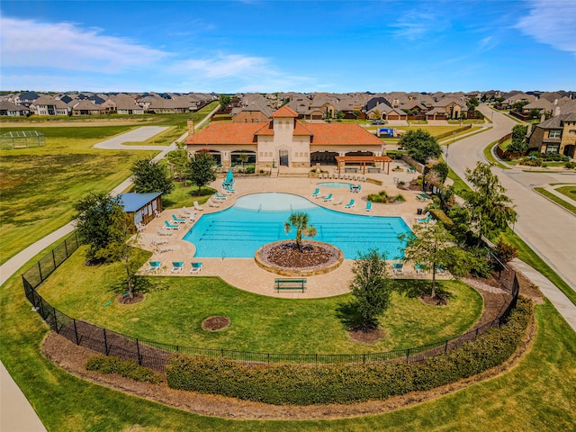 view of swimming pool with a patio and a lawn