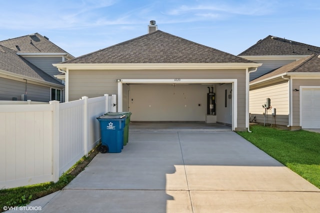 view of front of house with water heater and a garage