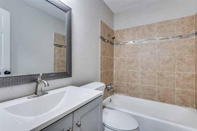 full bathroom with vanity, toilet, and tiled shower / bath