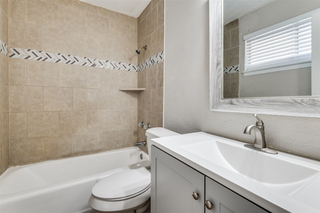 full bathroom with vanity, toilet, and tiled shower / bath