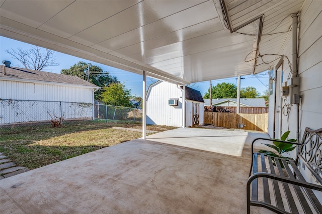 view of patio featuring a storage shed