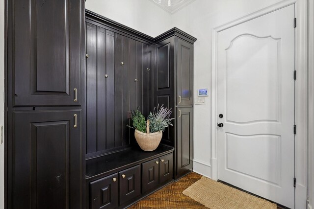 mudroom featuring crown molding