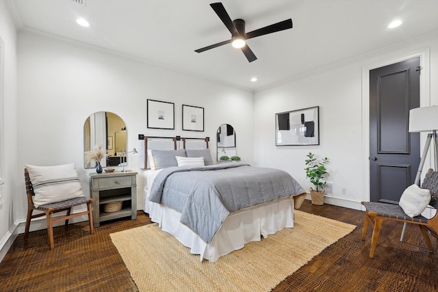 bedroom with ceiling fan, dark hardwood / wood-style flooring, and crown molding