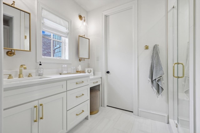 bathroom with vanity and an enclosed shower