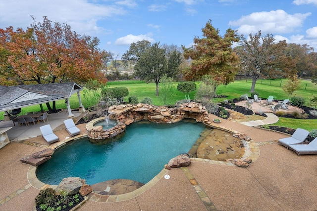 view of swimming pool featuring a gazebo, an in ground hot tub, a patio, and a lawn