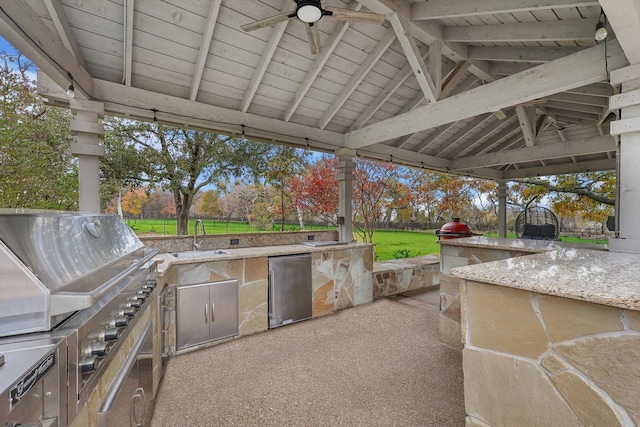 view of patio with sink, a gazebo, ceiling fan, a grill, and area for grilling