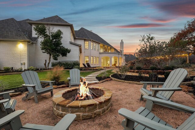 patio terrace at dusk with a bar and a gazebo