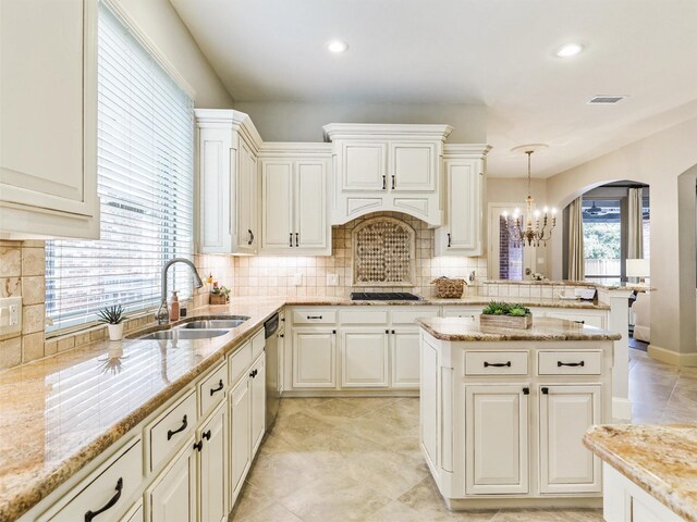 dining area with ceiling fan with notable chandelier and tile patterned flooring