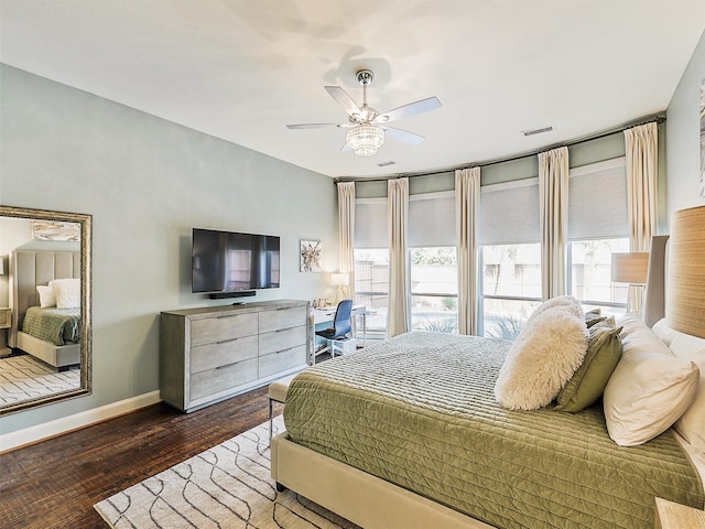 bedroom featuring ceiling fan and dark wood-type flooring