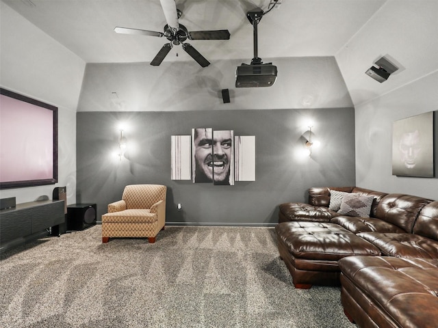 carpeted home theater featuring lofted ceiling and ceiling fan