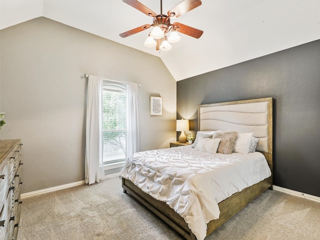 carpeted bedroom with ceiling fan and lofted ceiling