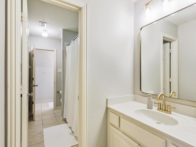 bathroom with vanity and tile patterned flooring