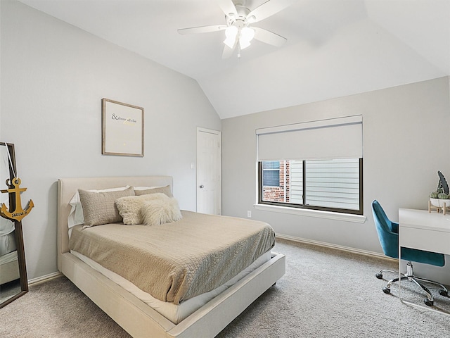 carpeted bedroom with ceiling fan and lofted ceiling