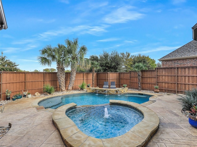 view of swimming pool with pool water feature, a patio area, and an in ground hot tub