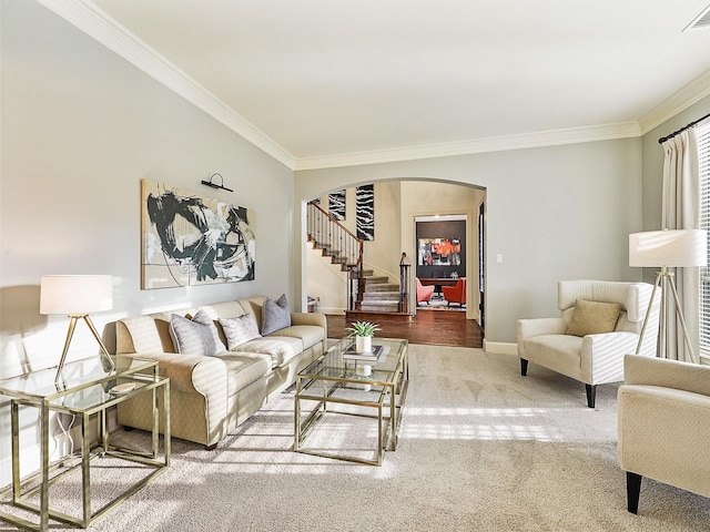 carpeted living room featuring ornamental molding