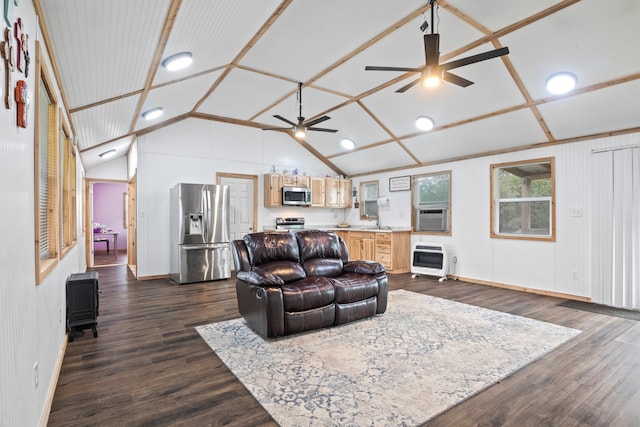 living room featuring lofted ceiling, sink, heating unit, dark hardwood / wood-style flooring, and ceiling fan