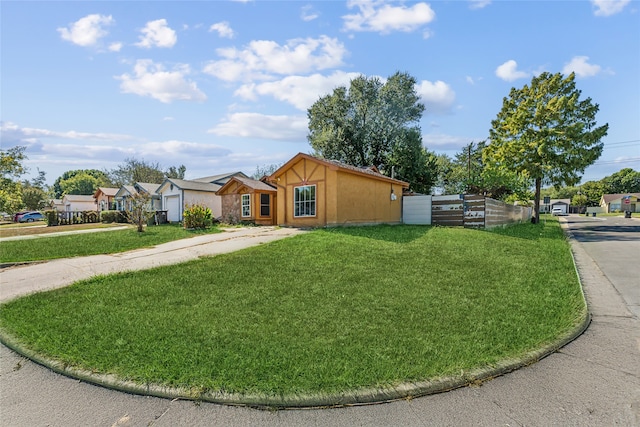 view of front of home featuring a garage and a front lawn