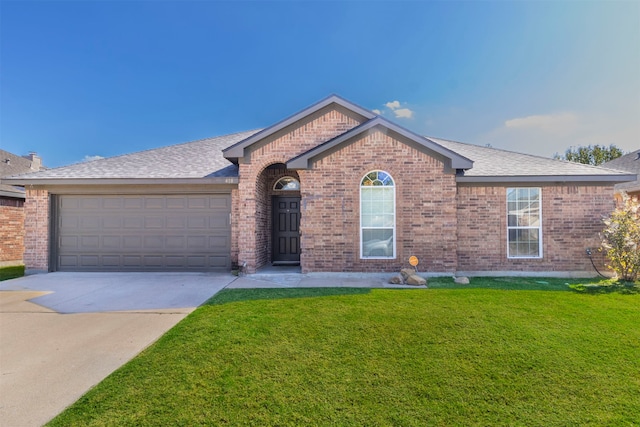 single story home featuring a front yard and a garage