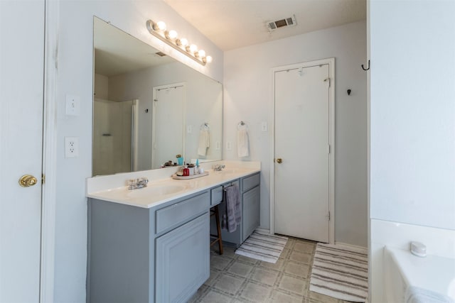 bathroom featuring vanity and plus walk in shower