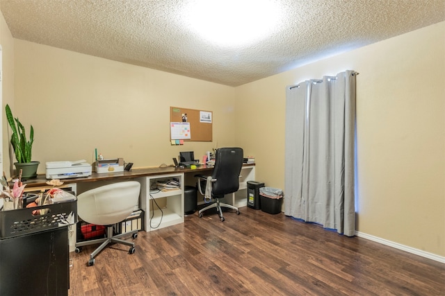 office space with dark hardwood / wood-style floors and a textured ceiling