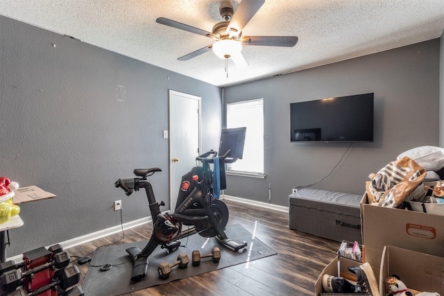 418 Mcmurtry Dr, Arlington, TX 76002 - exercise area with ceiling fan, wood finished floors, a textured ceiling, a textured wall, and baseboards