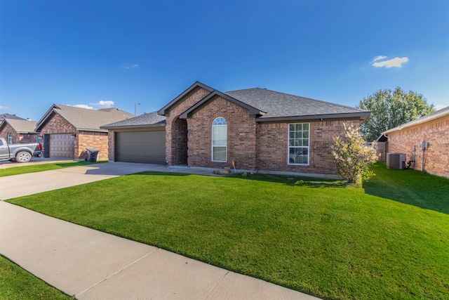 single story home featuring a front yard, cooling unit, and a garage