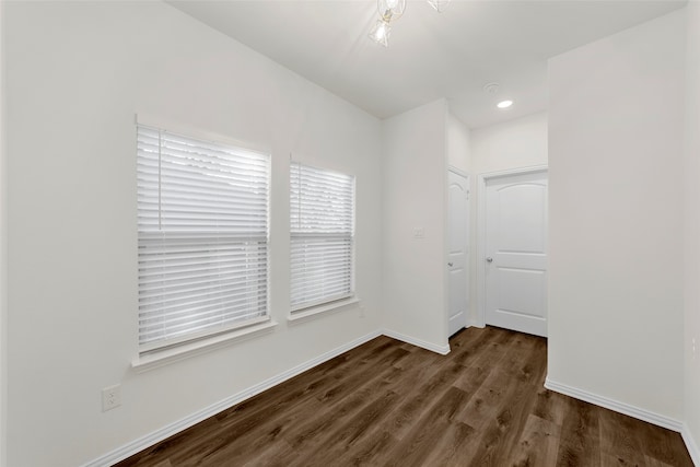 unfurnished room featuring dark hardwood / wood-style flooring