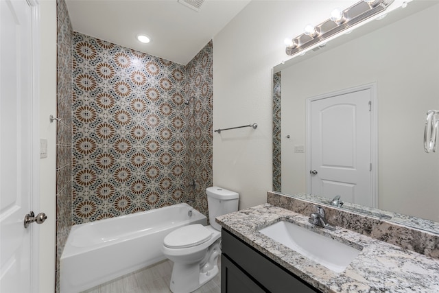 full bathroom with bathtub / shower combination, vanity, and toilet