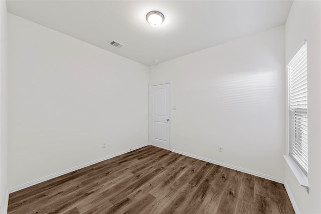 empty room featuring dark hardwood / wood-style floors