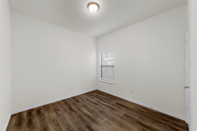 unfurnished room featuring dark hardwood / wood-style floors