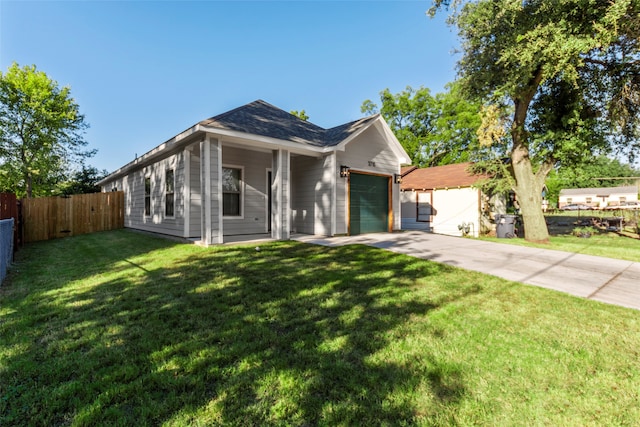 ranch-style home with a front yard and a garage