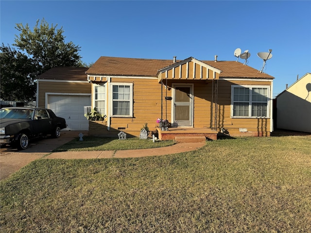 view of front of property featuring a garage and a front yard