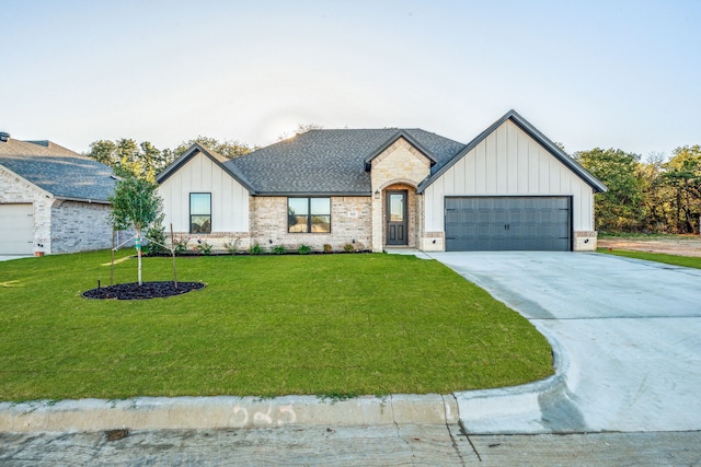 modern farmhouse style home with a front yard and a garage