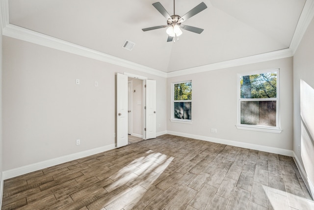 unfurnished bedroom featuring hardwood / wood-style floors, ceiling fan, lofted ceiling, and crown molding