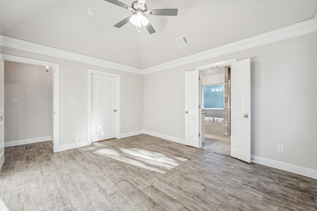 unfurnished bedroom featuring ensuite bathroom, crown molding, vaulted ceiling, light hardwood / wood-style flooring, and ceiling fan