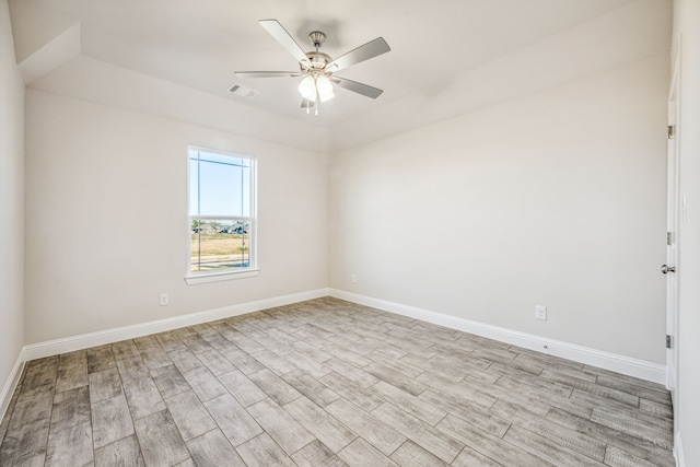 spare room featuring ceiling fan and light hardwood / wood-style flooring