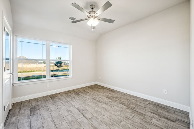 unfurnished room with light hardwood / wood-style flooring, ceiling fan, and lofted ceiling