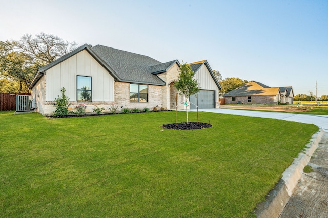 modern inspired farmhouse featuring a front yard, a garage, and central air condition unit