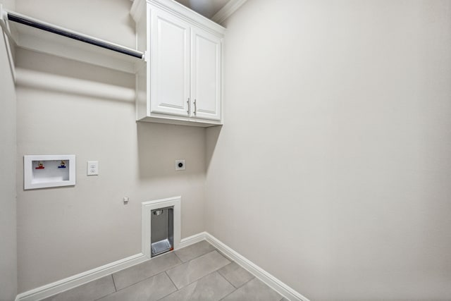 laundry area with electric dryer hookup, cabinets, gas dryer hookup, hookup for a washing machine, and light tile patterned floors