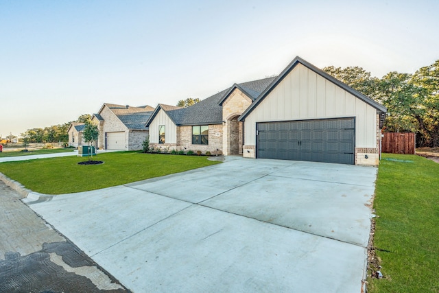 view of front of house with a garage and a front yard