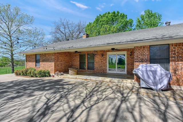 1062 Jp Cave Rd, Sherman, TX 75090 - rear view of property with a ceiling fan, brick siding, a patio area, and a chimney