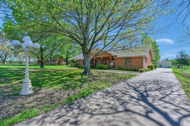 1062 Jp Cave Rd, Sherman, TX 75090 - ranch-style house with a front lawn and brick siding