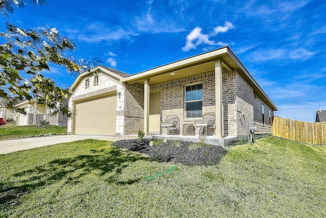 view of front facade featuring a front lawn, covered porch, and a garage