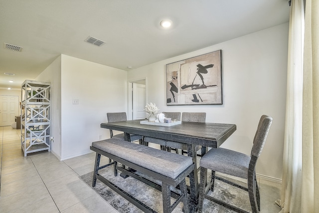 dining area with light tile patterned floors