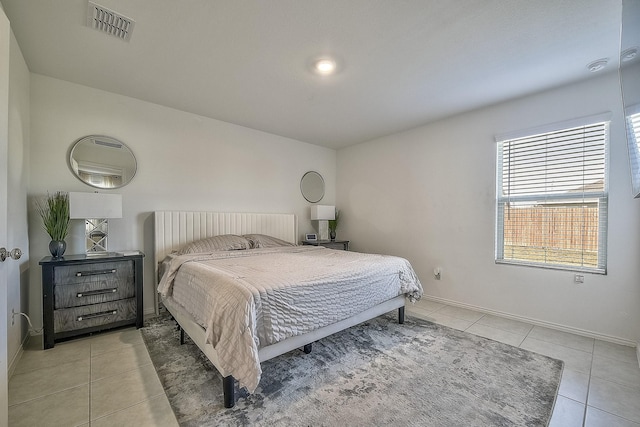 bedroom with light tile patterned floors