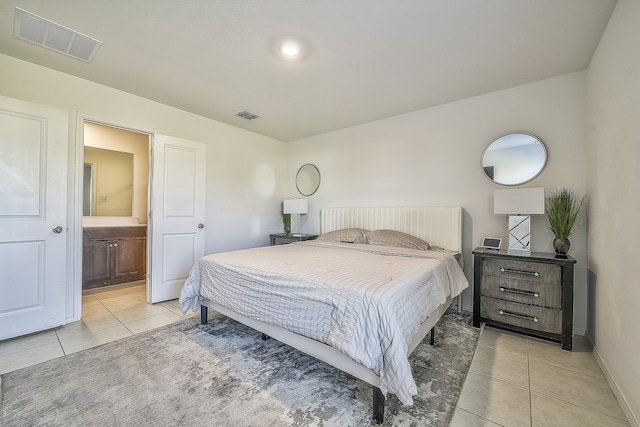 tiled bedroom with ensuite bathroom