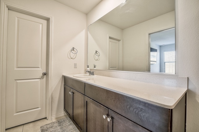 bathroom with tile patterned flooring and vanity