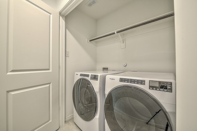 laundry room with washer and dryer