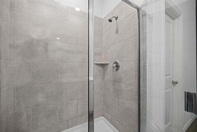 bathroom featuring an enclosed shower