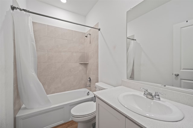 full bathroom with shower / bath combination with curtain, toilet, and vanity